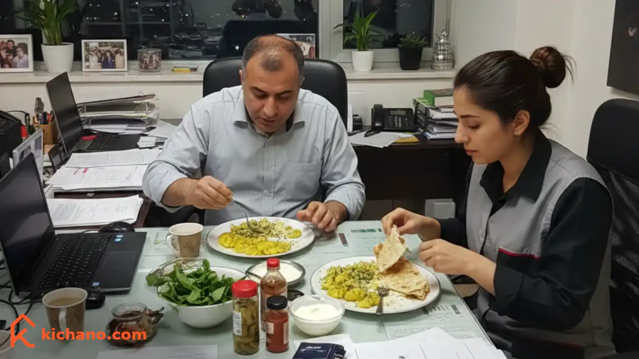 دو شخص ایرانی در محل کار در حال خوردن شام ساده با سیب زمینی